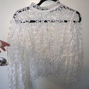 Lace patterned mock neck top